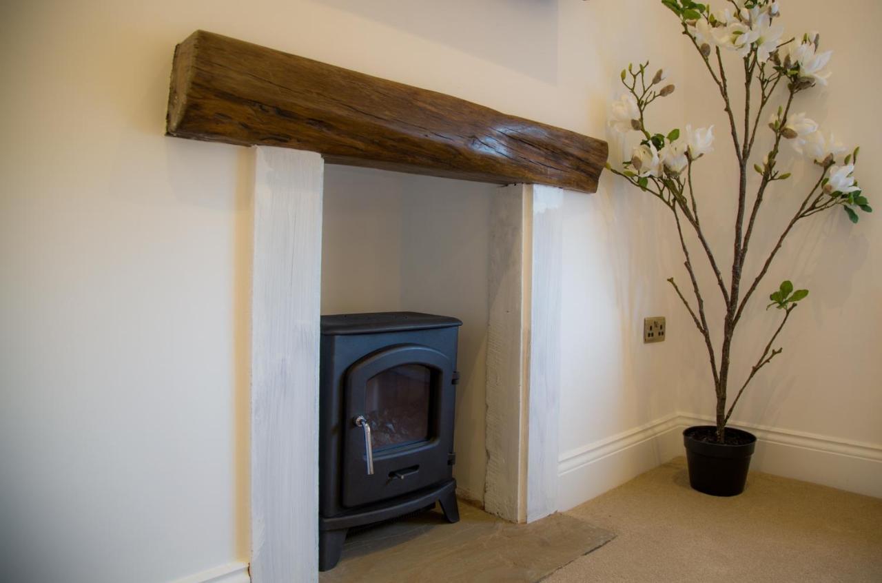 Winckley Stays Preston  Exterior photo A fireplace with a log burning stove