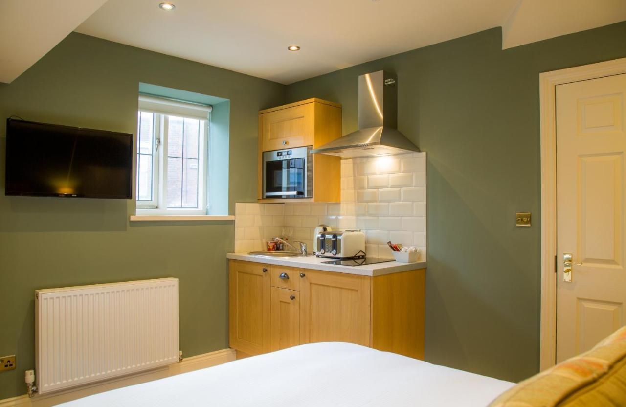 Winckley Stays Preston  Exterior photo A small kitchen in a studio apartment